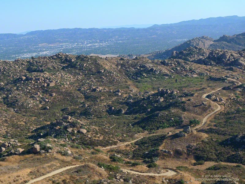 Rocky Peak fire road below Rocky Peak. This is about mile 3-4 on the way out, and mile 28-29 on the way back. The west San Fernando Valley and Santa Monica Mountains are in the distance.