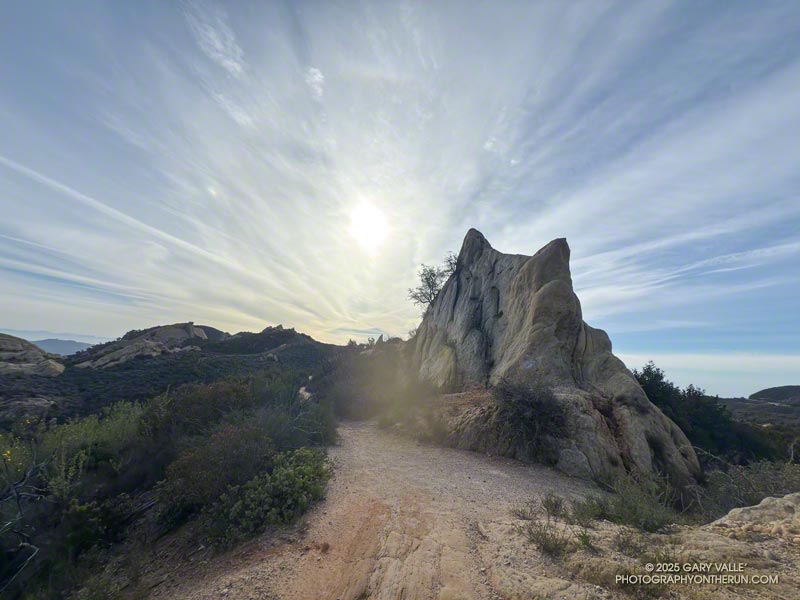 Rock formation, cirrus clouds, and contrails along the Backbone Trail, near the Corral Canyon Trailhead. March 16, 2025.