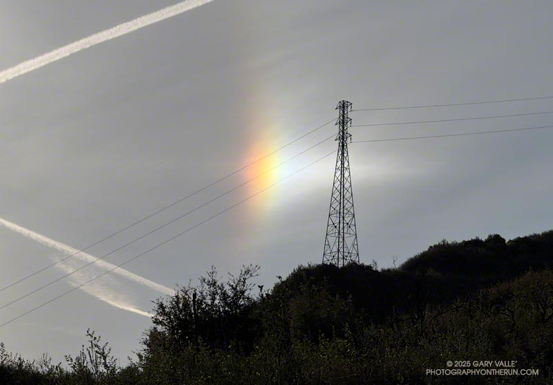 A colorful sundog (parhelion) on the 22 degree halo visible on the Bulldog climb. March 16, 2025.