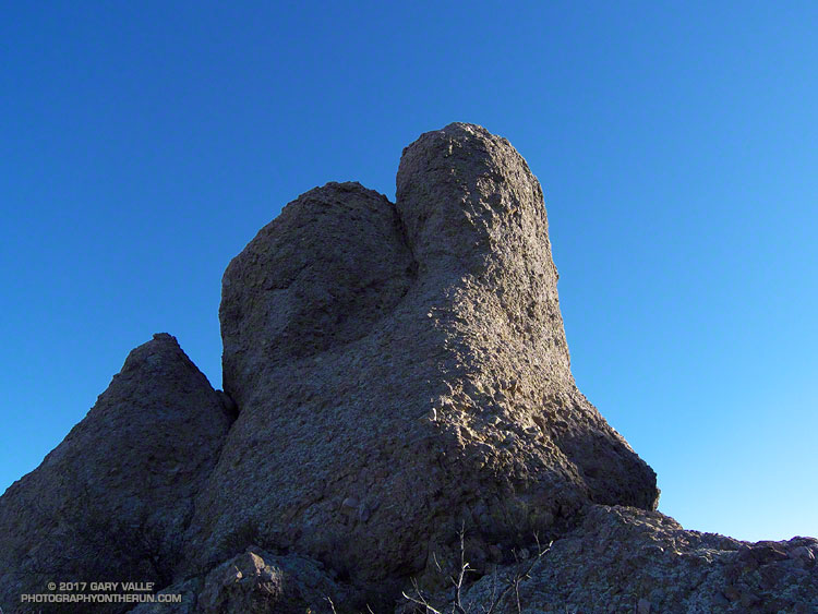 The rock on the western ridge is a relatively hard and erosion resistant breccia  that is part of the Conejo Volcanics.