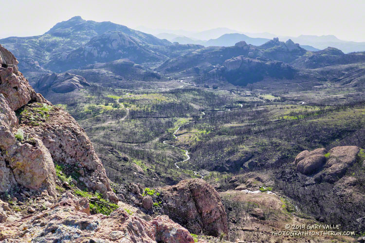 Hazy view toward Sandstone Peak from the shoulder of Tri Peaks. March 24, 2019.