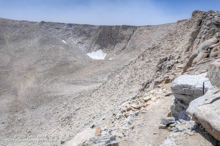 First switchback on the east side of New Army Pass. The snow patch in the cirque is the most persistant in the area.