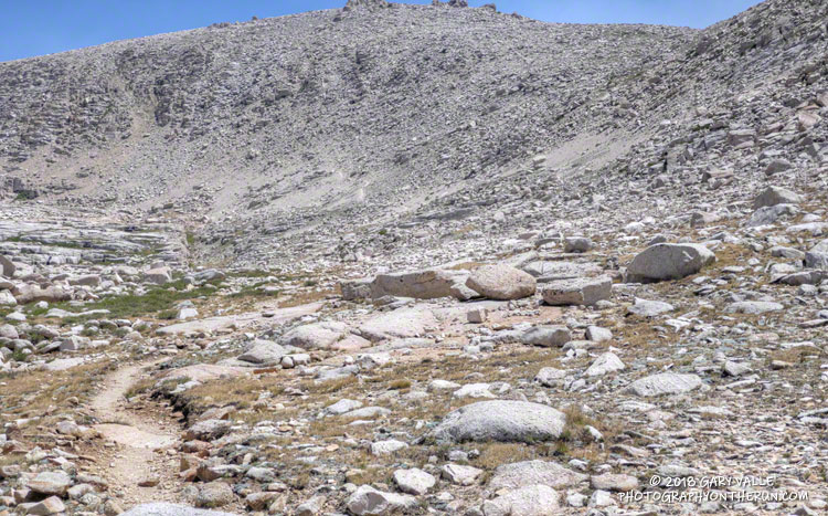 Approaching the glacier-cut headwall in Rock Creek basin.  The trail goes to the base of the headwall and then right,