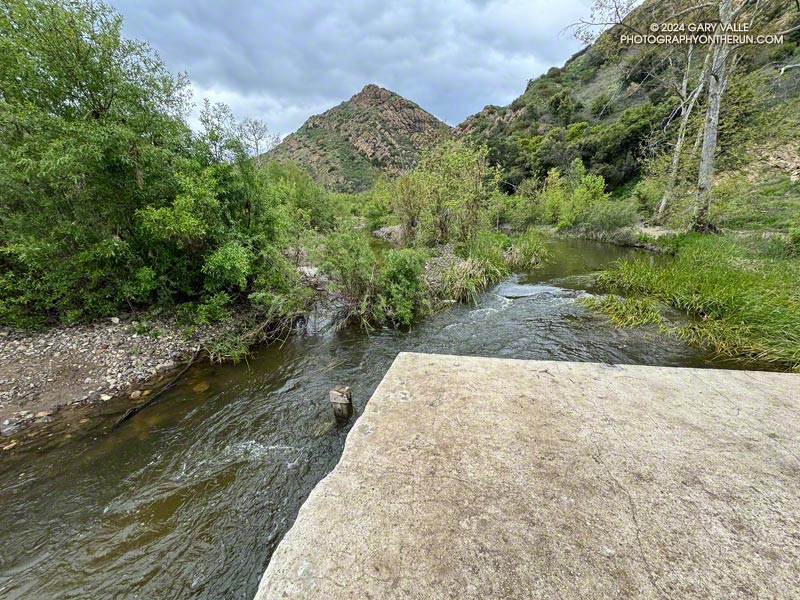 The makeshift log bridge was gone  following several inches of rain at the end of March. April 4, 2024.
