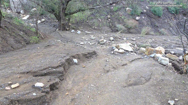 View down Danielson Road near its junction with the Upper Sycamore Trail. Flow in the streambed is from left to right. Note the incision pattern of the flow from the road into the streambed.
