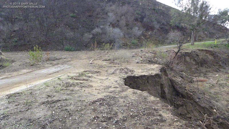 Looking down Sycamore Canyon Fire Road at erosion from the same mud and debris flow as in the previous image.