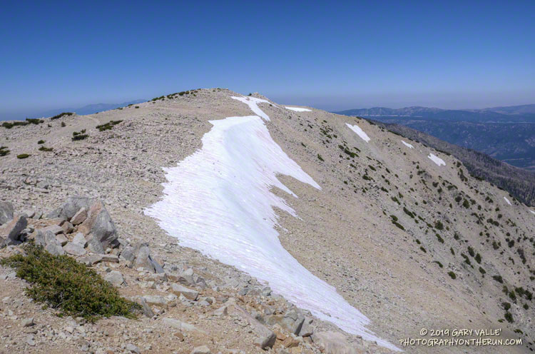 Snow band near the summit of San Gorgonio Mountain. This is at the top of a northeast-facing cirque that held a pocket glacier in the last ice age. July 27, 2019.