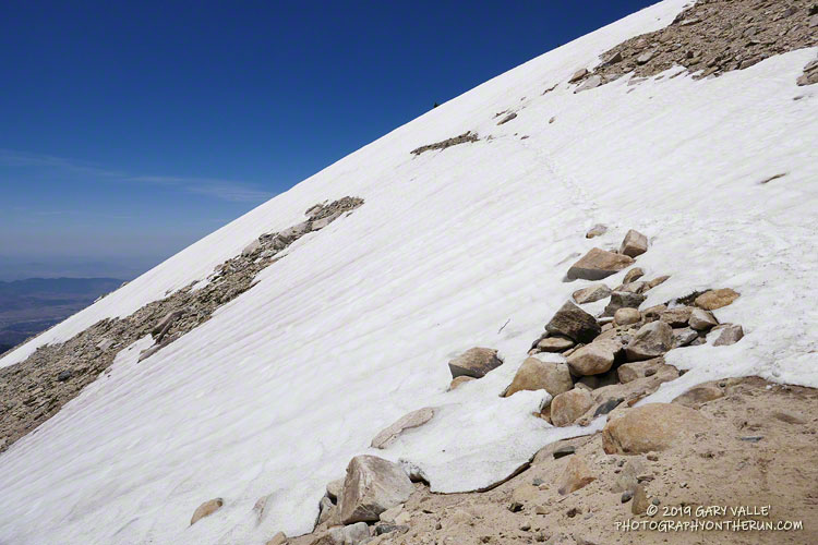 Looking back up at a large patch of snow on the Sky High Trail after crossing it. Elevation is about 11,100'. July 27, 2019.