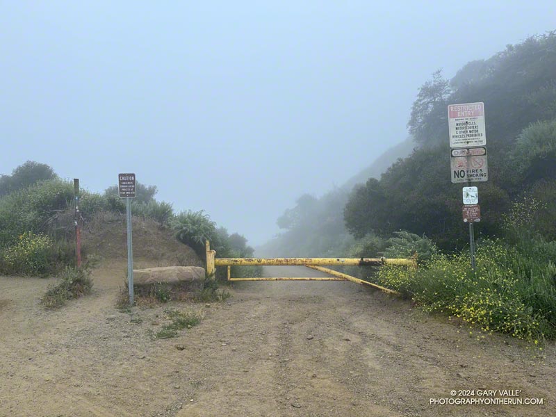 The top of Sullivan Ridge Fire Road on dirt Mulholland. The junction is east of the Top of Reseda and about 2.5 miles from the trailhead. The official name of the Top of Reseda is Marvin Braude Mulholland Gateway Park.