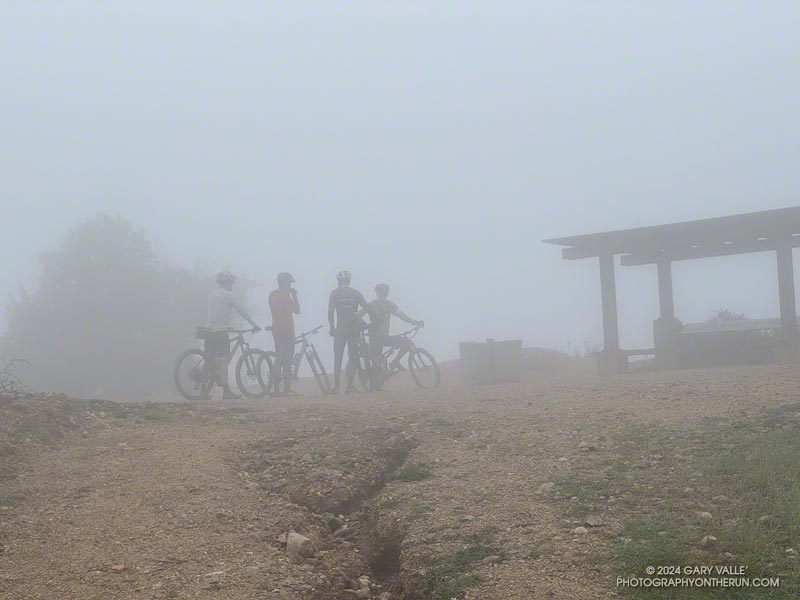 Mountain bikers at the Hub, a 4-way junction where Fire Road #30 meets Temescal Ridge Fire Road, Eagle Springs Fire Road, and Eagle Rock Fire road. February 17, 2024.