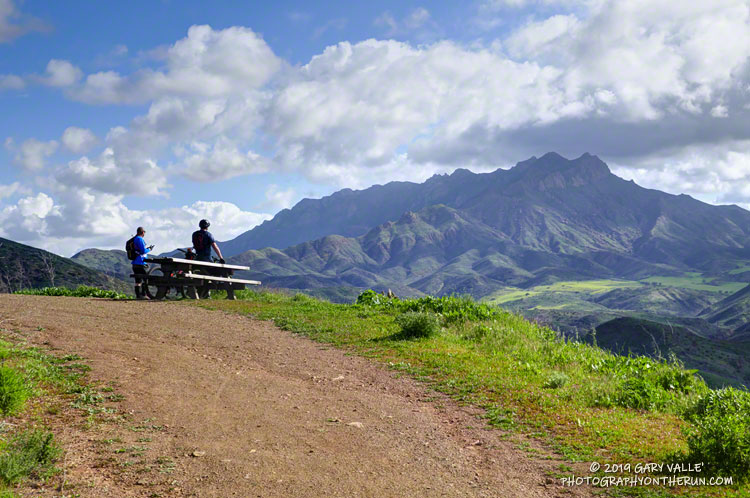 Mountain bikers enjoy the view of Boney Mountain and Serrano Valley from Overlook Fire Road in Pt. Mugu State Park.